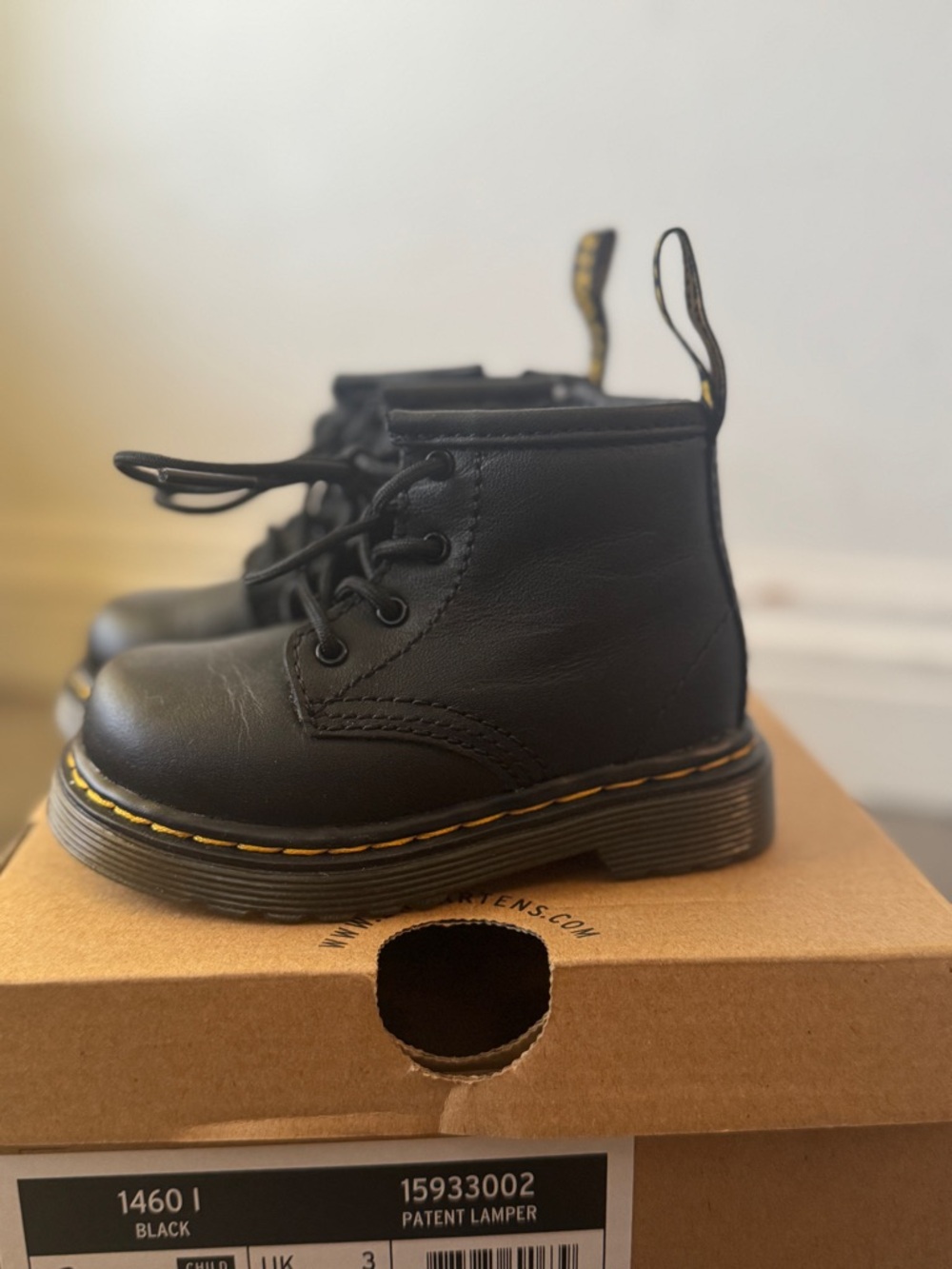 Dr. Martens Kids Black Patent Leather Lace-Up Boots with Yellow Stitching - Picture 2 of 3